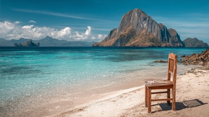 The sand near the water is where a wooden beach chair is currently sitting