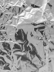 Wrinkled Shiny Silver Aluminum Foil Texture Background