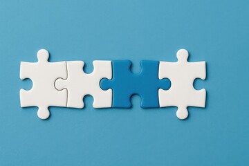 Fototapeta premium Creative Concept of Puzzle Pieces with a Missing Element Representing Strategy, Problem Solving, Collaboration, Teamwork, and Innovation on a Blue Background