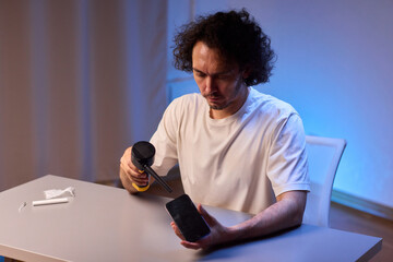 The Innovative Smartphone Cleaning Device is Being Demonstrated During Use and Functionality