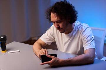 Cleaning a smartphone screen with a tissue needs attention for optimal hygiene and care