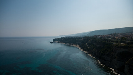 Cliffside Town, Boats, and Blue Sea – Aerial View of Coastal Landscape in Calabria, Italy
