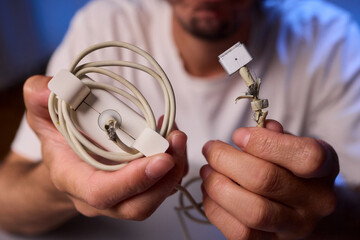 Carefully Repairing a Damaged Charging Cable with Skillful Hands for Best Results and Safety