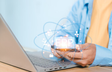 Business people using a laptop with document management for ERP. Enterprise resource planning concept,Enterprise Resource Management ERP software system for business resources plan presented.
