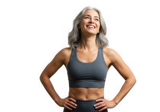 Smiling woman in workout gear looking upwards with hands hips on transparent background