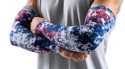 Athlete in a gray shirt wearing colorful elbow sleeves, arms crossed in a confident pose.