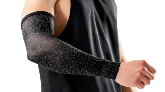 Athletic arm sleeve on a person wearing a black tank top, isolated on white background.