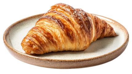 Freshly baked croissant on a round plate, golden brown with flaky layers.
