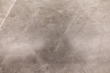 Obraz premium Concrete texture with scratches and markings displayed in neutral tones and soft lighting