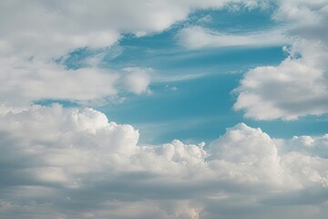 Obraz premium Beautiful Blue Sky Filled with Fluffy White Clouds Creating a Dreamy and Peaceful Atmosphere Perfect for Backgrounds and Wallpapers