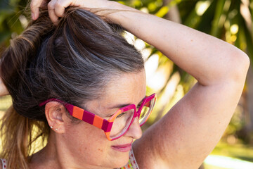 Beautiful Woman with Long Gray Hair and Modern Glasses. Natural Beauty and Timeless Style