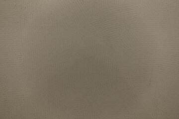 Textured surface with intricate patterns and soft color tones revealing tactile details during natural light