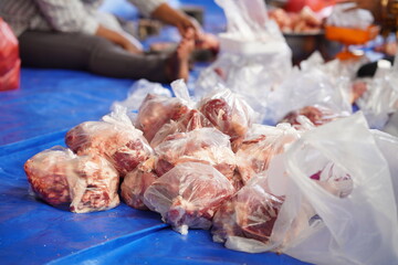 workers process goat meat for eid al-adha