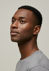 Obraz premium Portrait of a young man with short hair looking to the side.