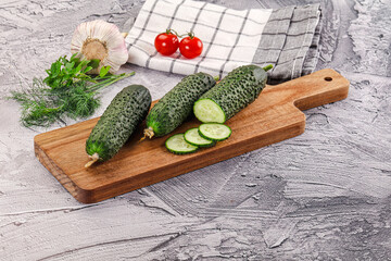Raw green cucumbers with slices
