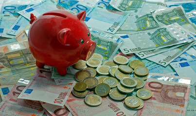 euro money paper and coins and money pig