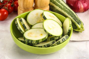 Raw green zucchini slices for cooking