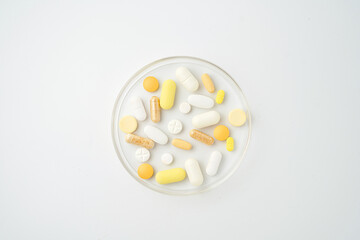 Clock made of pills capsules, pills form a circle, omega, vitamins, Cod liver oil, supplements