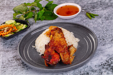 Spicy roasted chicken wing with rice