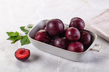 Raw ripe purple plum heap