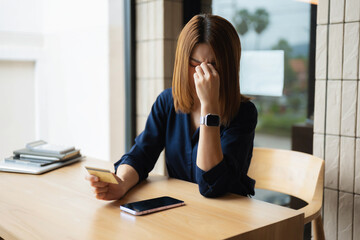 Stressed asian woman facing credit card debt crisis.