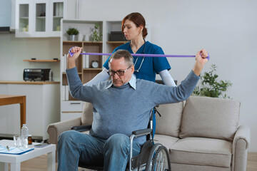 senior man doing exercise at clinic with physiotherapist. help of a therapist trainer during a rehabilitation session.