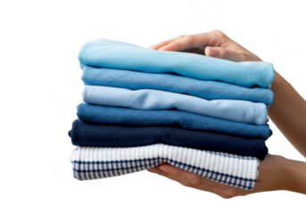 Hands carefully holding a neat stack of folded blue and white clothing items isolated on transparent background