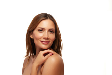 A woman showcases her glowing skin and confidence, highlighting her natural beauty while gently...