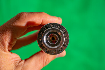 Green laser light chrome metal flashlight front.