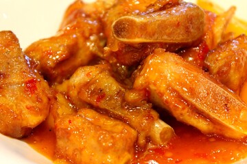  Glazed sweet and sour pork ribs in chili sauce, Chinese comfort food close-up