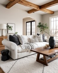A cozy living room featuring a light-colored sofa and a wooden coffee table.