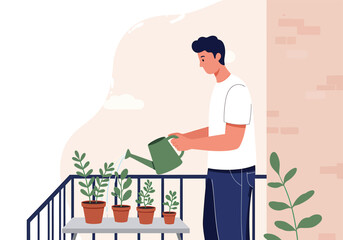 A man waters potted plants on a balcony, tending to his green garden.