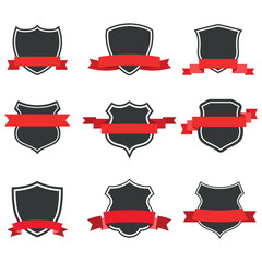 illustration of set of shields with red ribbons on white background.