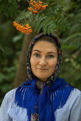 Beautiful woman in a traditional headscarf, summer outdoor