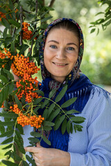 Beautiful woman in a traditional headscarf, summer outdoor