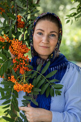 Beautiful woman in a traditional headscarf, summer outdoor