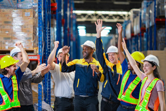 Warehouse team portrait with international staff. Powerful image for teamwork, diversity, and business cooperation campaigns.