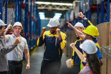 Centered African-American employee being recognized by team members in warehouse. Inspires themes of motivation, leadership, and success.