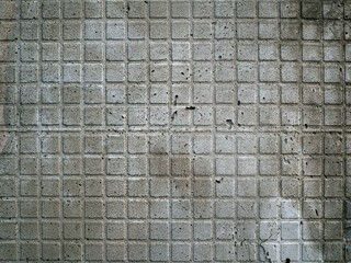 Abstract gray stone background with hardened tile adhesive. There were traces in the background - mesh grooves from the inner layer of fallen ceramic tiles.