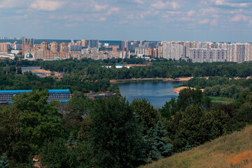Eastern Europe capital city living district background panorama urban view with foreground park and river scenery