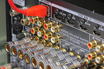 Rear panel of a high-quality AV receiver with multimedia connections for connecting speakers,...