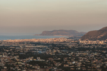 Panoramic sunset view of Palermo city and coastline from the hills