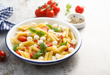 Pasta with mozzarella cheese and tomatoes