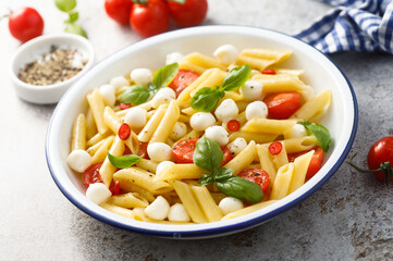 Pasta with mozzarella cheese and tomatoes