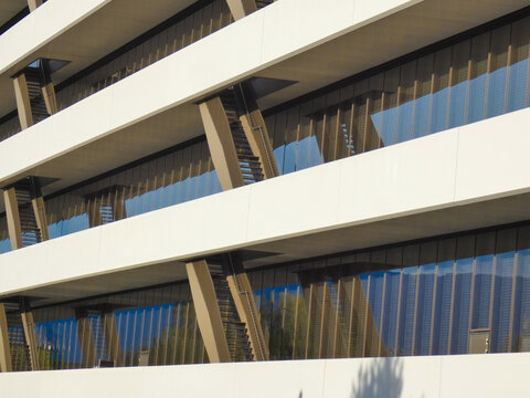 Close-up view of a white facade with many windows of a new corporate building with modern design near Geneva, Switzerland