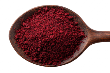 Close up shows red sumac spice powder in a wooden spoon against a transparent background for cooking use