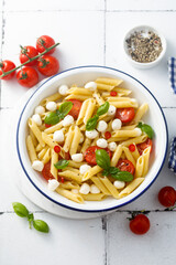 Pasta with mozzarella cheese and tomatoes