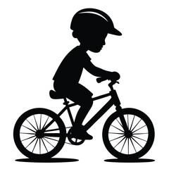 Fototapeta premium Child Riding a Bicycle in Silhouette