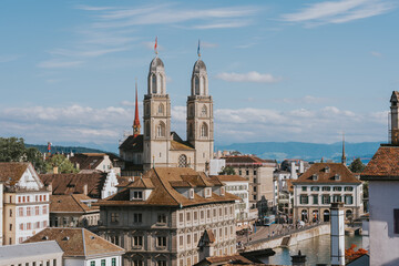 Fototapeta premium Grossmunster church dominating zurich skyline on a sunny day