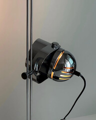 Close-up view of illuminated chrome spotlight lamp.